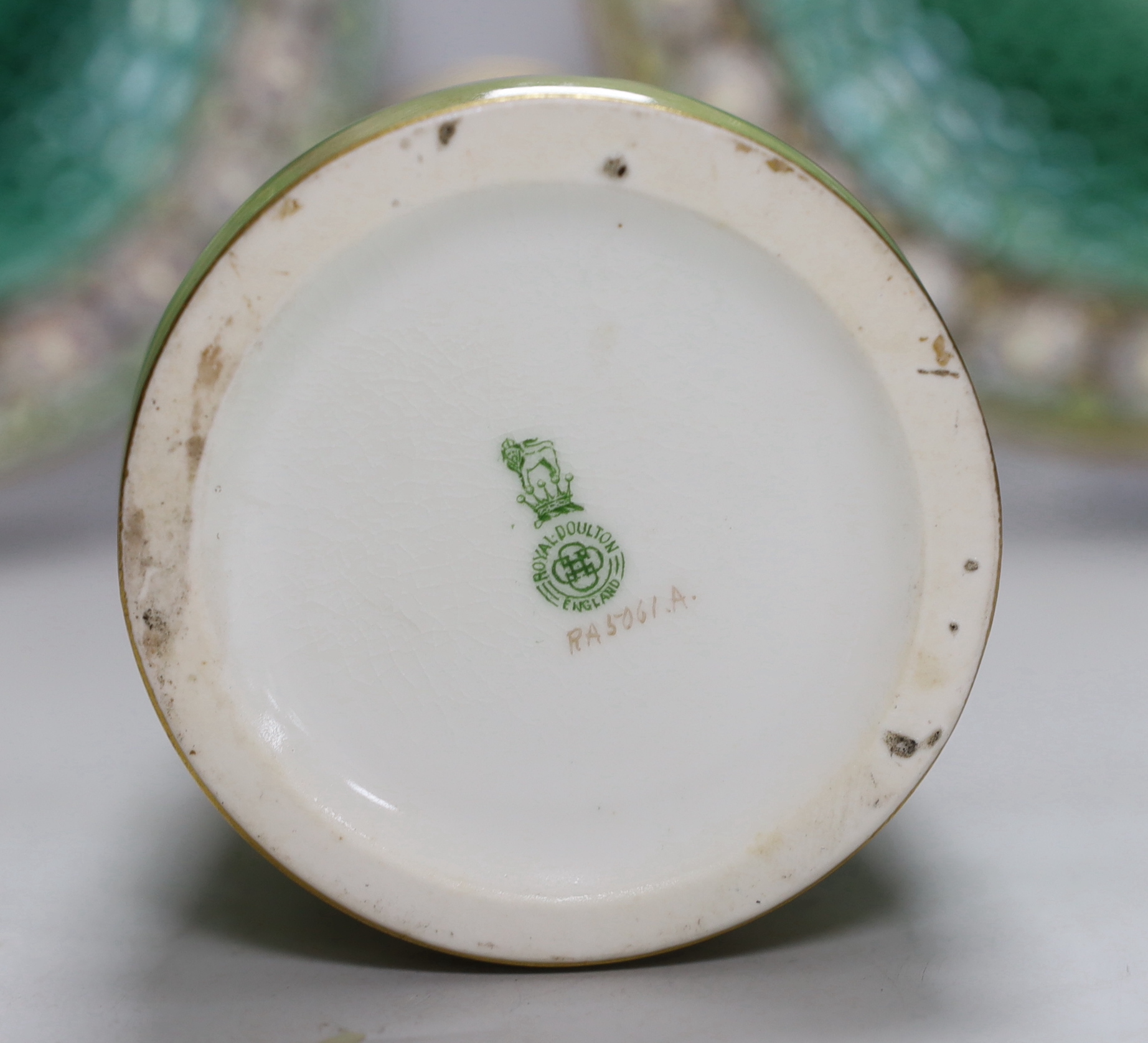 A pair of Wedgwood Majolica plates and a Royal Doulton floral vase painted by Joseph Hancock, 30cm high